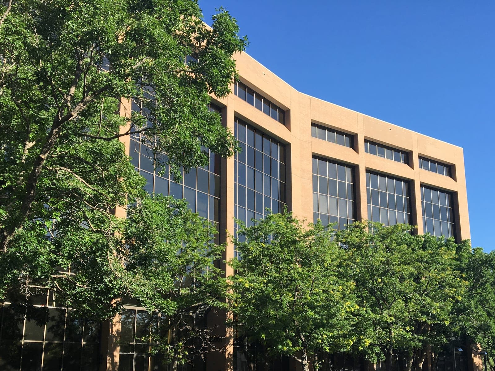 The office building that houses Blue Sky Smiles, under a clear blue sky.
